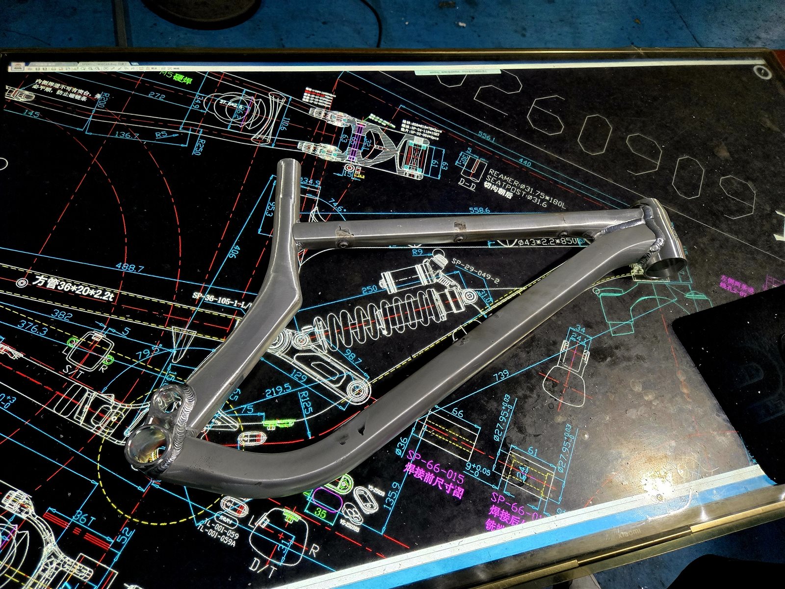 Bicycle frame laid over its engineering blueprint